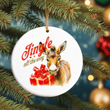 Christmas ornament with donkey and 'Jingle all the way' text on a tree.
