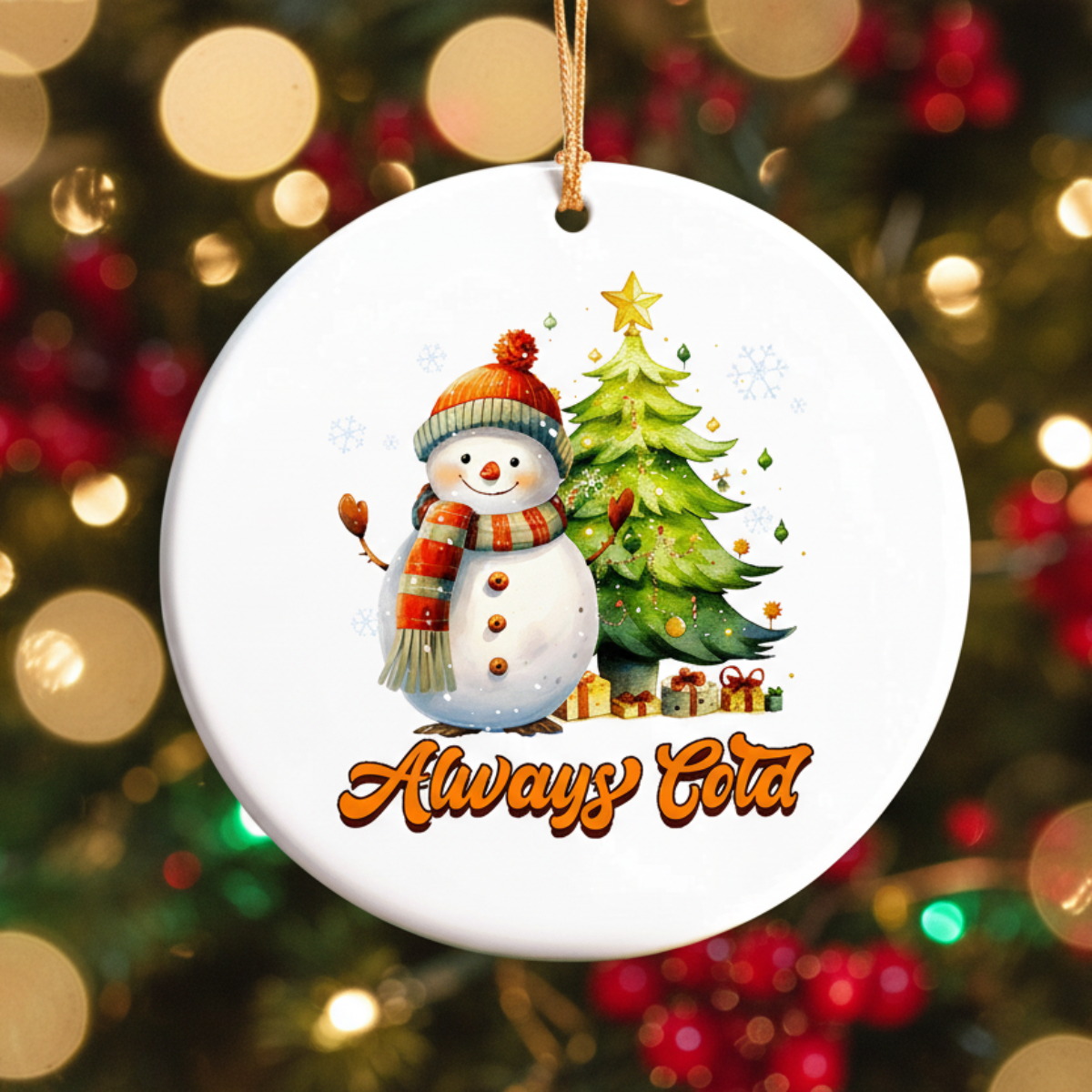 Christmas ornament with a snowman and tree design against a blurred Christmas tree background.