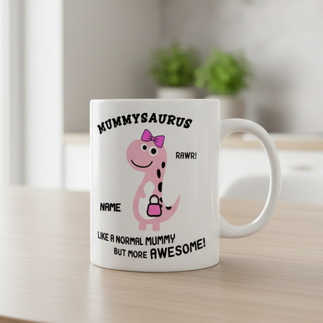White mug with pink dinosaur graphic and text on a wooden surface