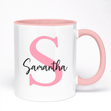 White mug with pink interior and handle, featuring a pink letter 'S' and the name 'Samantha'.